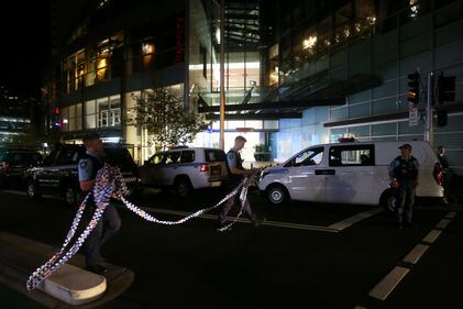 BONDI JUNCTION, AUSTRALIA - APRIL 13: NSW police prepare to cordon off an area outside Westfield Bondi Junction on April 13, 2024 in Bondi Junction, Australia. Six victims, plus the offender, are confirmed dead following an incident at Westfield Shopping Centre in Bondi Junction, Sydney. (Photo by Lisa Maree Williams/Getty Images)