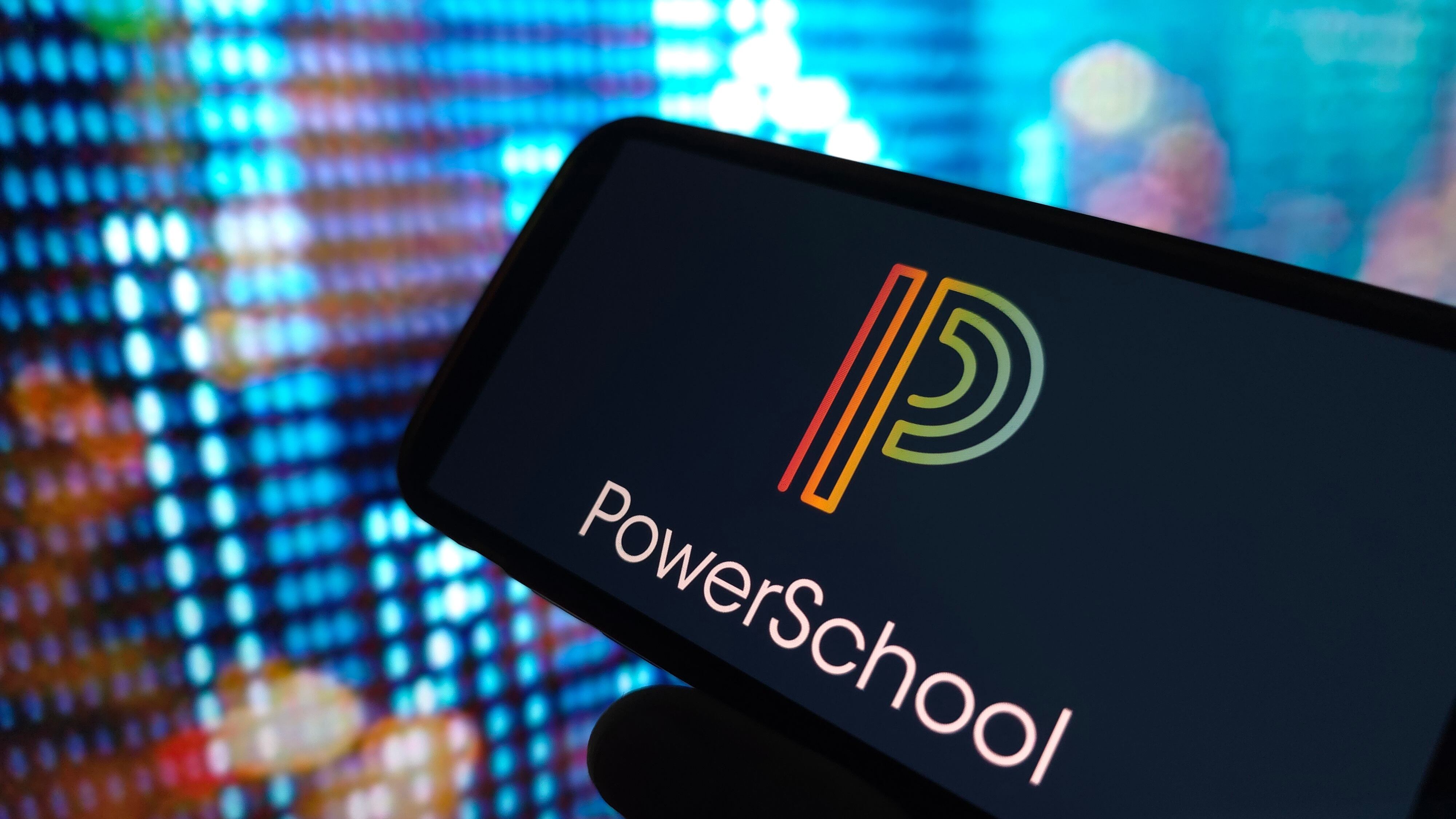 PowerSchool company logo displayed on mobile phone