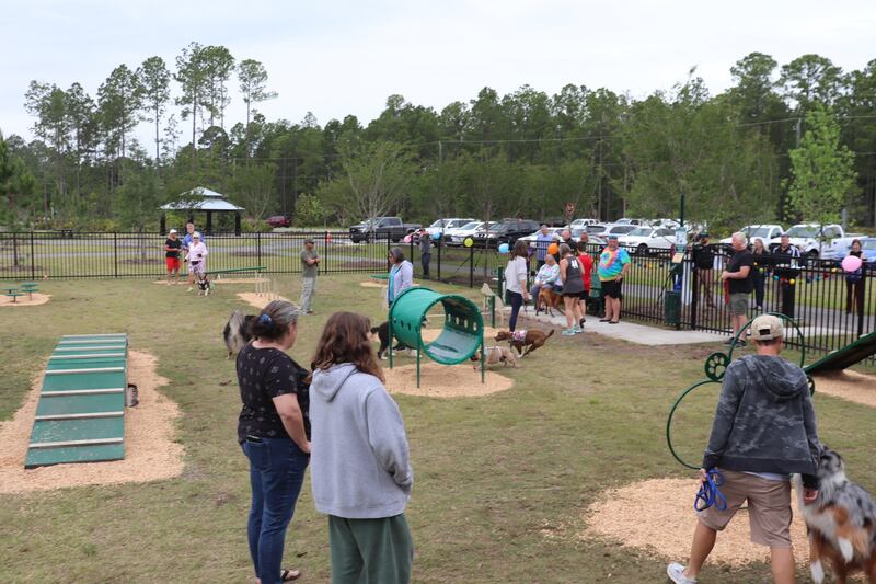 The new dog park includes obstacles in a fenced in area within Nassau Crossing Park.