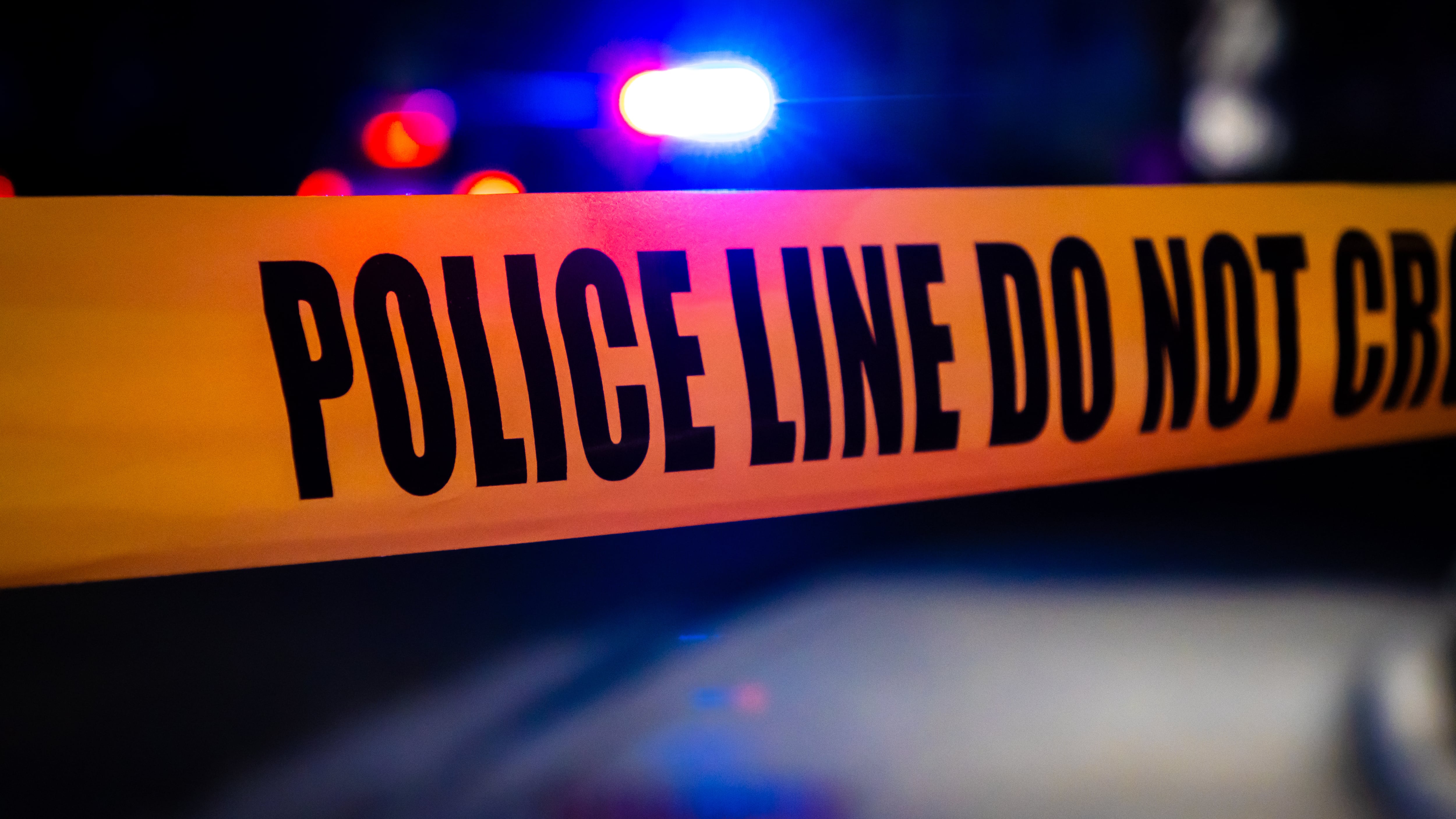 Police tape at a crime scene.