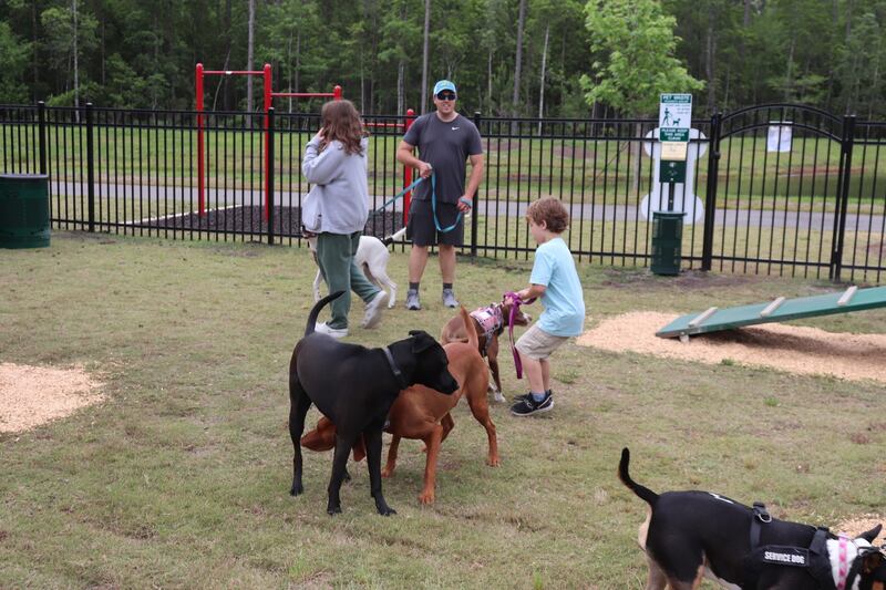 Everyone had a good time at the grand opening of the dog park in Nassau Crossing park.