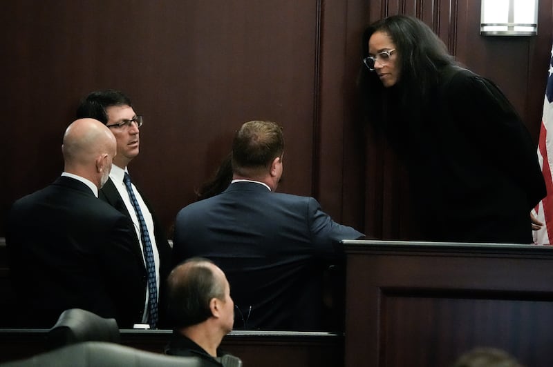 Defense Attorney James Hill, left, Assistant State Attorneys Alan Mizrahi and Christina Stifler and Defense Attorney Jesse Dreicer hold a bench conference in Judge London Kite’s courtroom, Monday August 10, 2026 during the jury selection in Mario Fernandez Saldana’s first-degree murder and solicitation to commit a capital felony trial at the Duval County Court House in Jacksonville, Fla. [Doug Engle/Florida Times-Union]