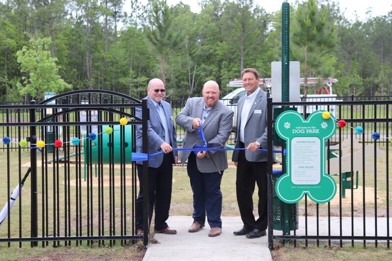 Nassau City Commissioner Klynt Farmer cut the ribbon on the new bark park on Monday.