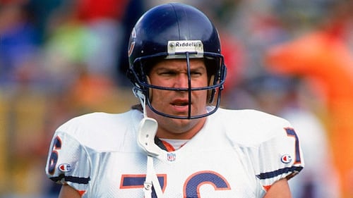 Steve McMichael on a football field.
