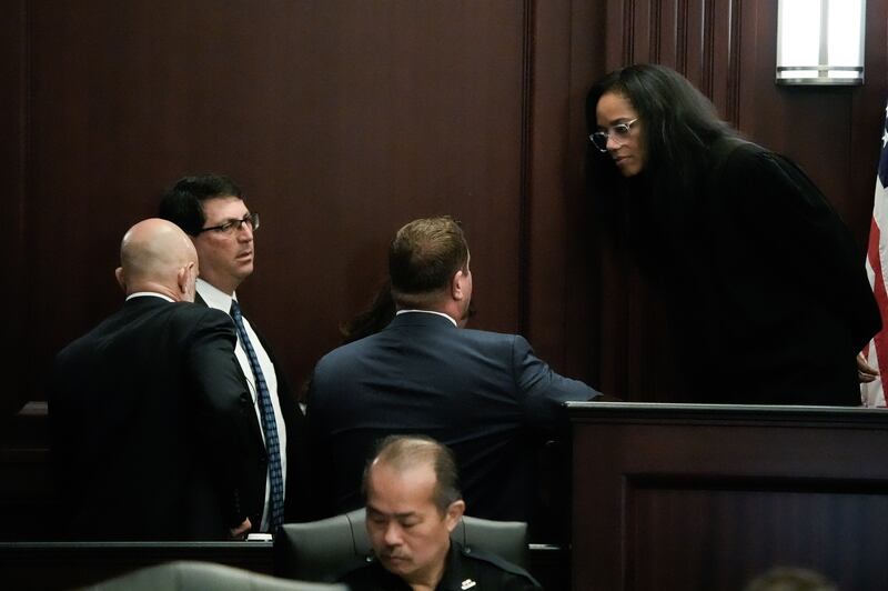 Defense Attorney James Hill, left, Assistant State Attorneys Alan Mizrahi and Christina Stifler and Defense Attorney Jesse Dreicer hold a bench conference in Judge London Kite’s courtroom, Monday August 10, 2026 during the jury selection in Mario Fernandez Saldana’s first-degree murder and solicitation to commit a capital felony trial at the Duval County Court House in Jacksonville, Fla. [Doug Engle/Florida Times-Union]