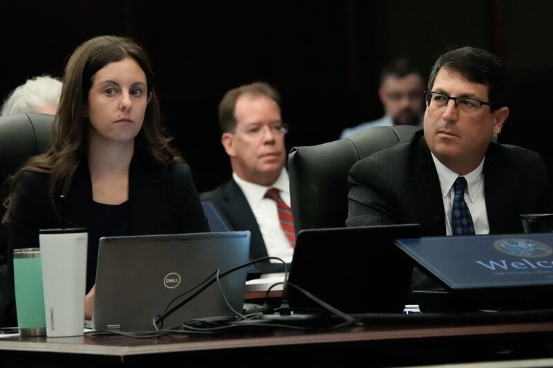 Assistant State Attorneys Christina Stifler, left and Alan Mizrahi, right, listen as Judge London Kite reads instructions to potential jurors during Mario Fernandez Saldana’s murder trial Monday, August 10, 2026 at the Duval County Courthouse in Jacksonville, Fla.  [Doug Engle/Florida Times-Union]
