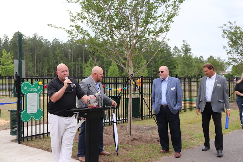 City officials were on hand to celebrate the opening of the new dog park within Nassau Crossing Park.