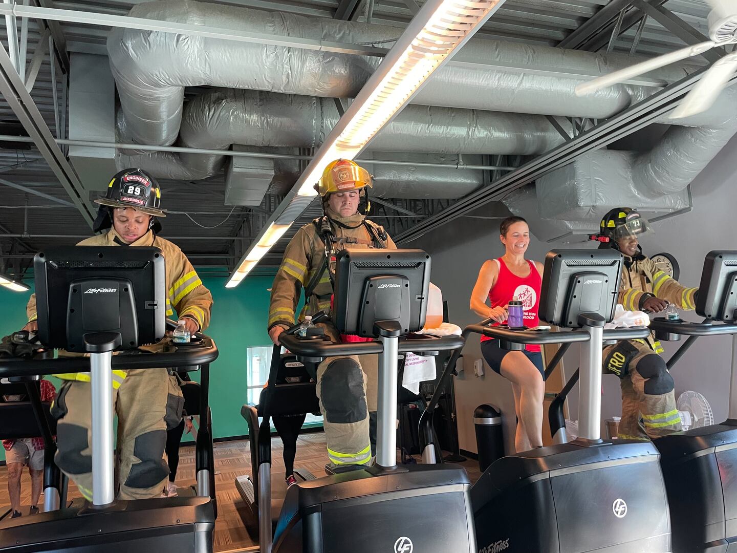 JFRD firefighters Brittany Strong, John Castrovinci and Nick Billups completed the climb, along with YMCA member, Amy Chong.