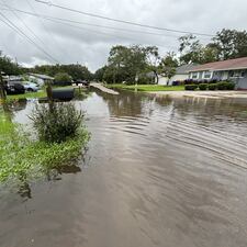 Homes and road are flooded.