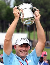 Padragh Harrington holds up the trophy after winning the U.S. Senior Open Championship golf tournament at the Broadmoor, Sunday, June 29, 2025, in Colorado Springs, Colo. (Jerilee Bennett/The Gazette via AP)