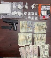 During the execution of a search warrant, a handgun, 2.5 pounds of cocaine, bags, scales, and money were found.