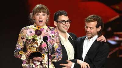 LOS ANGELES, CALIFORNIA - MARCH 14: (L-R) Taylor Swift, Jack Antonoff, and Aaron Dessner accept the Album of the Year award for ‘Folklore’ onstage during the 63rd Annual GRAMMY Awards at Los Angeles Convention Center on March 14, 2021 in Los Angeles, California. (Photo by Kevin Winter/Getty Images for The Recording Academy)