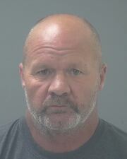 Jason Curtis was arrested in the death of a man who was found shot to death with his 4-year-old daughter sitting next to his body.
